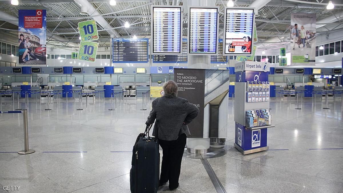 A passenger looks for information in the