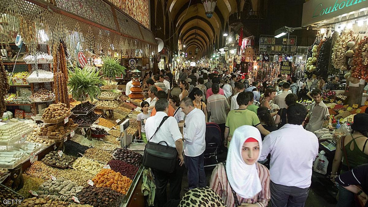 Turks buy goods at the Grand Bazaar in I
